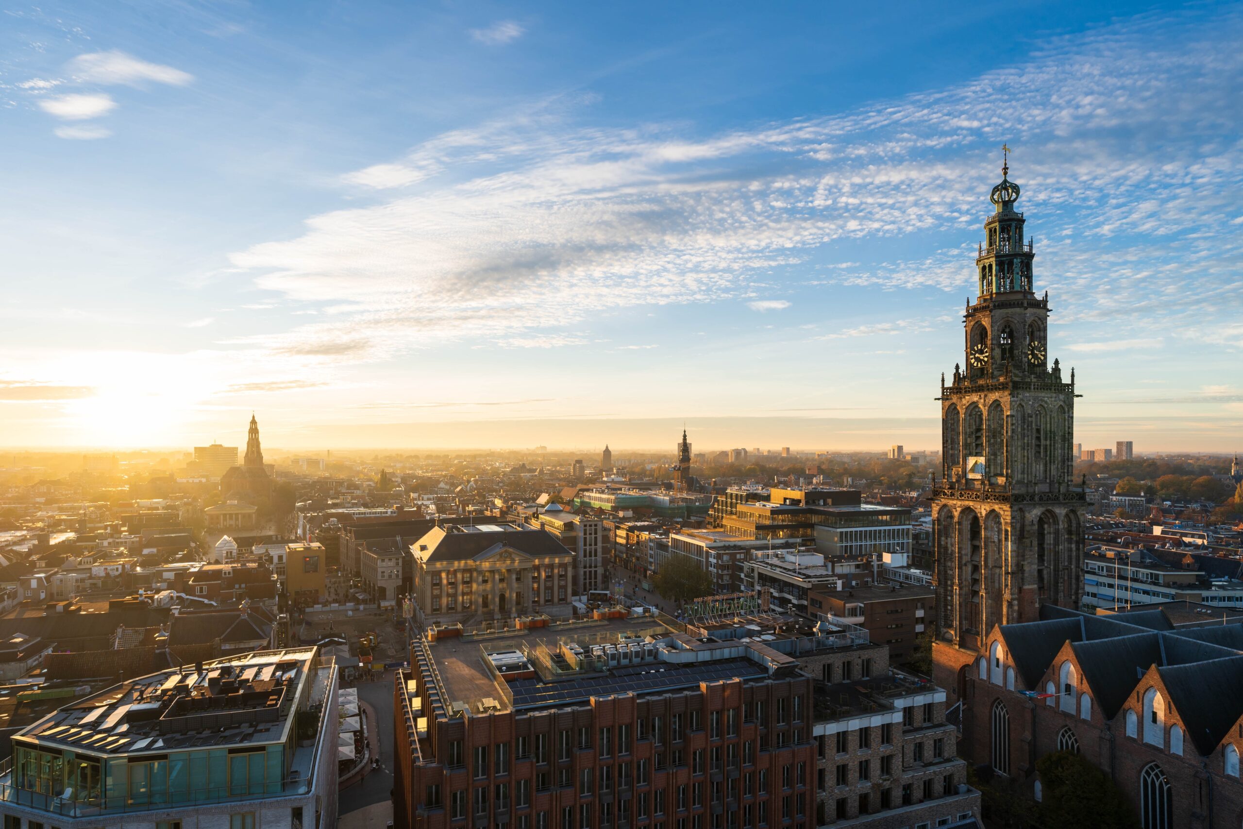 The,Sun,Setting,At,The,Martinitoren,And,The,Historical,City The,Sun,Setting,At,The,Martinitoren,And,The,Historical,City